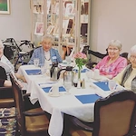residents of Melrose Meadows in the dining room