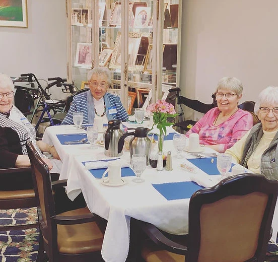 residents of Melrose Meadows in the dining room