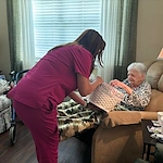 Montclair Park Assisted and Independent Senior Living in Shreveport, LA resident being helped by a staff member