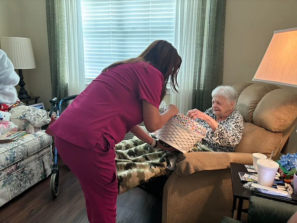 Montclair Park Assisted and Independent Senior Living in Shreveport, LA resident being helped by a staff member