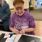 Pioneer Valley Lodge Gracious Retirement Living Hawthorn Senior Independent Living in North Logan, Utah resident making a Christmas countdown craft