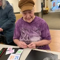 Pioneer Valley Lodge Gracious Retirement Living Hawthorn Senior Independent Living in North Logan, Utah resident making a Christmas countdown craft