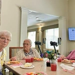 Charter Memory Care of Moline residents enjoy a celebration