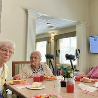Charter Memory Care of Moline residents enjoy a celebration