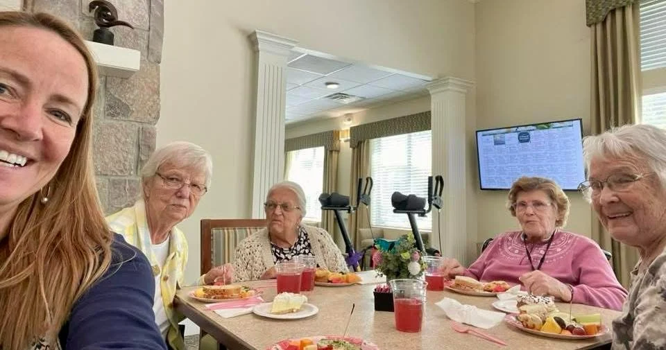 Charter Memory Care of Moline residents enjoy a celebration