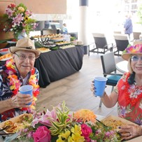 John Knox Village Of Florida, Inc. CCRC senior living in Pompano Beach, FL residents dressed in Hawaiian for a party