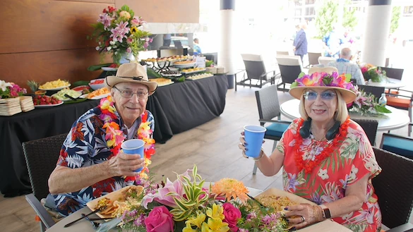 John Knox Village Of Florida, Inc. CCRC senior living in Pompano Beach, FL residents dressed in Hawaiian for a party