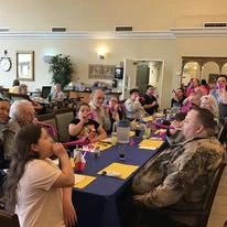 Avamere at Moses Lake senior living community offering independent living, assisted living, and respite care in Moses Lake, WA, resident and family gathering with games