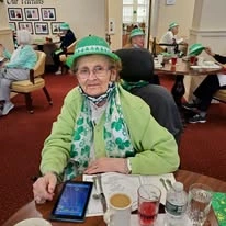 resident dressed up for St. Patrick's Day at Magnolia Heights Gracious Retirement Living Hawthorn Senior Independent Living in Franklin, Massachusetts