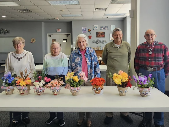 senior residents making flower arrangements