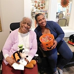 American House Dearborn Heights, senior living community offering independent living and respite care in Dearborn Heights, MI, resident and staff member on Halloween