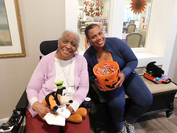American House Dearborn Heights, senior living community offering independent living and respite care in Dearborn Heights, MI, resident and staff member on Halloween