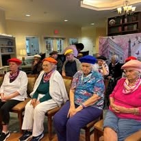 seniors learning about france at Serenades at Longwood