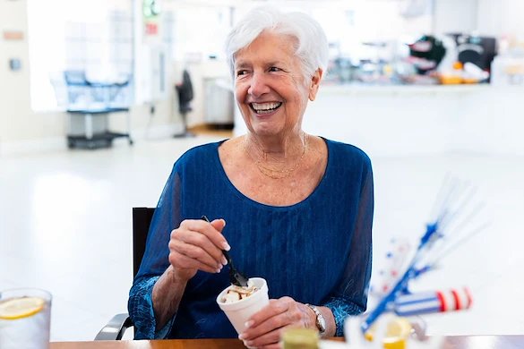 Photo of resident enjoying ice cream in the cafe at Fellowship Square Surprise