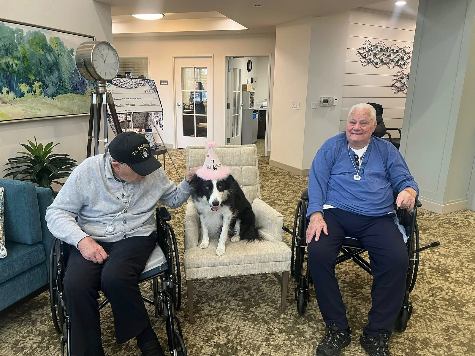 Charter Senior Living of Brookfield residents enjoy a visit from a dog