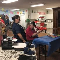 Colonial Harbor Gracious Retirement Living Hawthorn Senior Independent Living in Yorktown, Virginia resident shooting a nerf gun