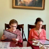 Parker Place Gracious Retirement Living Hawthorn Senior Independent Living in Mentor, Ohio residents looking at a restaurant menu