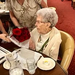 Meadowlark Estates Gracious Retirement Living Hawthorn Senior Independent Living in Lawrence, Kansas resident receiving a bouquet of flowers