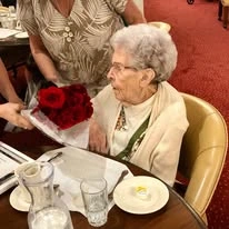Meadowlark Estates Gracious Retirement Living Hawthorn Senior Independent Living in Lawrence, Kansas resident receiving a bouquet of flowers