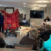 Ovation Heartwood Preserve Senior Living in Omaha, Nebraska residents watching a magic show