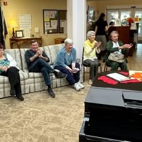 Stoneybrook Lodge Gracious Retirement Living Hawthorn Senior Independent Living in Corvallis, Oregon residents laughing and clapping