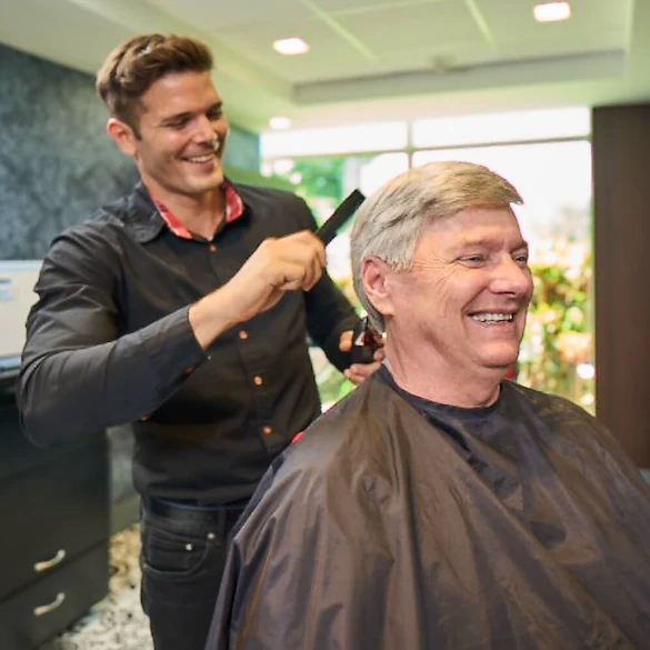 John Knox Village Of Florida, Inc. CCRC senior living in Pompano Beach, FL resident getting a haircut