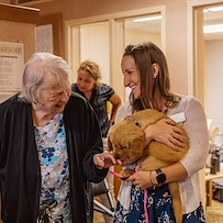 Vineyard Park of Port Orchard resident enjoys visit from therapy dog