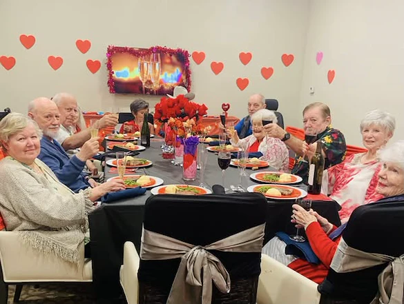 The Vincent Senior Living residents raising their glasses for Valentine's Day