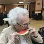 Ascension Living Sacred Heart Village Senior Living in Avilla, Indiana resident eating watermelon