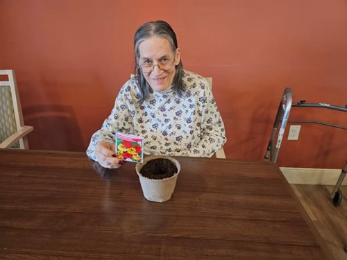 Residents of Broadwell Senior Living at Plymouth planted flowers for National Plant a Flower Day