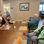 Bennett Place in New Albany, IN, residents laughing and having fun playing a game