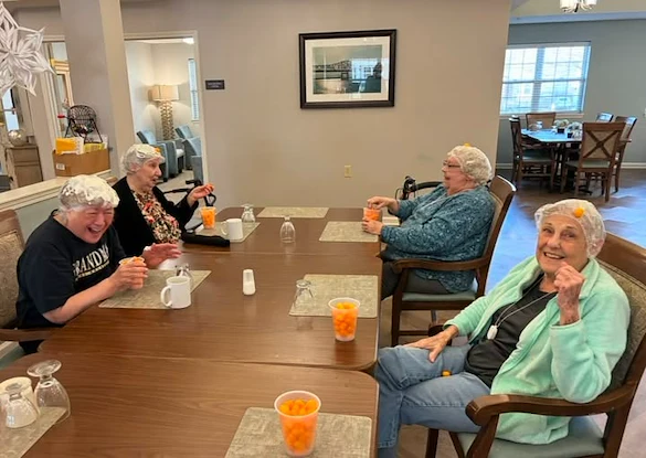 Bennett Place in New Albany, IN, residents laughing and having fun playing a game