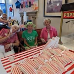 The Peaks At Santa Rita Active Retirement Living Hawthorn Senior Independent Living in Green Valley, Arizona residents in front of a popcorn machine