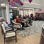 Avamere at St. Helens senior living community offering independent living, assisted living, memory care, and respite care in St. Helens, OR, residents spending time together at a Valentine's Day party