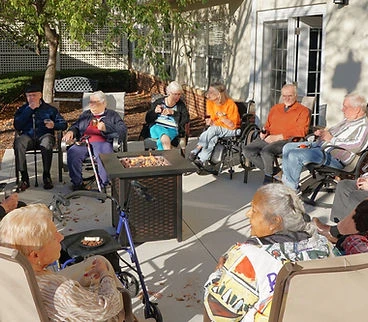 Sage Independence sitting around a firepit