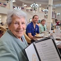 Alexis Estates Gracious Retirement Living Hawthorn Senior Living community in Allen, TX resident at dinner