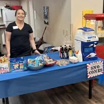 Avamere at Park Place Assisted Senior Living in Tigard, Oregon, staff member standing by snow cone station