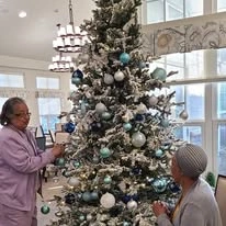 Wilshire Estates Gracious Retirement Living, independent living in Silver Spring, MD, residents decorating the Christmas tree