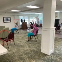 The Lodge at Wake Forest Gracious Retirement Living Hawthorn Senior Independent Living in Wake Forest, North Carolina residents doing a workout class