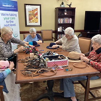 Brookdale Summer Ridge resident activity - decorating hats