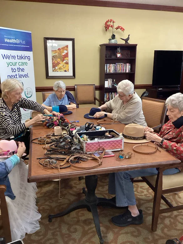 Brookdale Summer Ridge resident activity - decorating hats