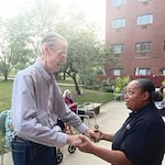 Ascension Casa Scalabrini Senior Living, independent senior living community in Northlake, IL, resident dancing with a staff member