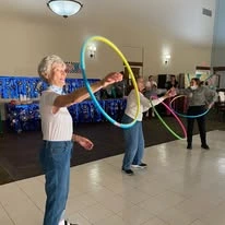 Ascension Living Alexian Village Tennessee Senior Living, independent living, assisted living, memory care, and continuing care retirement community (CCRC) in Signal Mountain, TN, residents playing with hula hoops and staying active