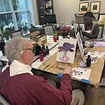 Charter Senior Living of Dedham in Dedham, MA, stimulating activity for residents - painting