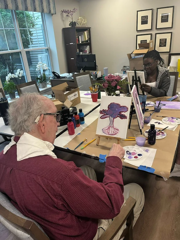 Charter Senior Living of Dedham in Dedham, MA, stimulating activity for residents - painting