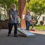 Gilman Grove Assisted Senior Living in Oregon City, Oregon residents having a bean bags cornhole tournament