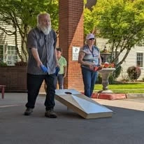 Gilman Grove Assisted Senior Living in Oregon City, Oregon residents having a bean bags cornhole tournament