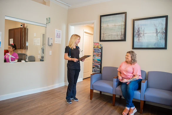 Franklin Park at Sonterra resident being seen by a health staff member