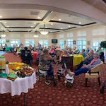 Ashton Gardens Gracious Retirement Living Hawthorn Senior Living Community in Portland, Maine residents at dinner