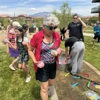 The Villas at Ovation Independent Senior Living in Washington, Utah residents having a water balloon fight